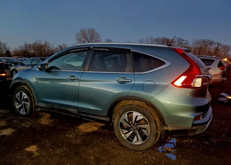 2016 Honda Cr-V Touring z USA, uszkodzony, nr VIN 5J6RM4H98GL010428